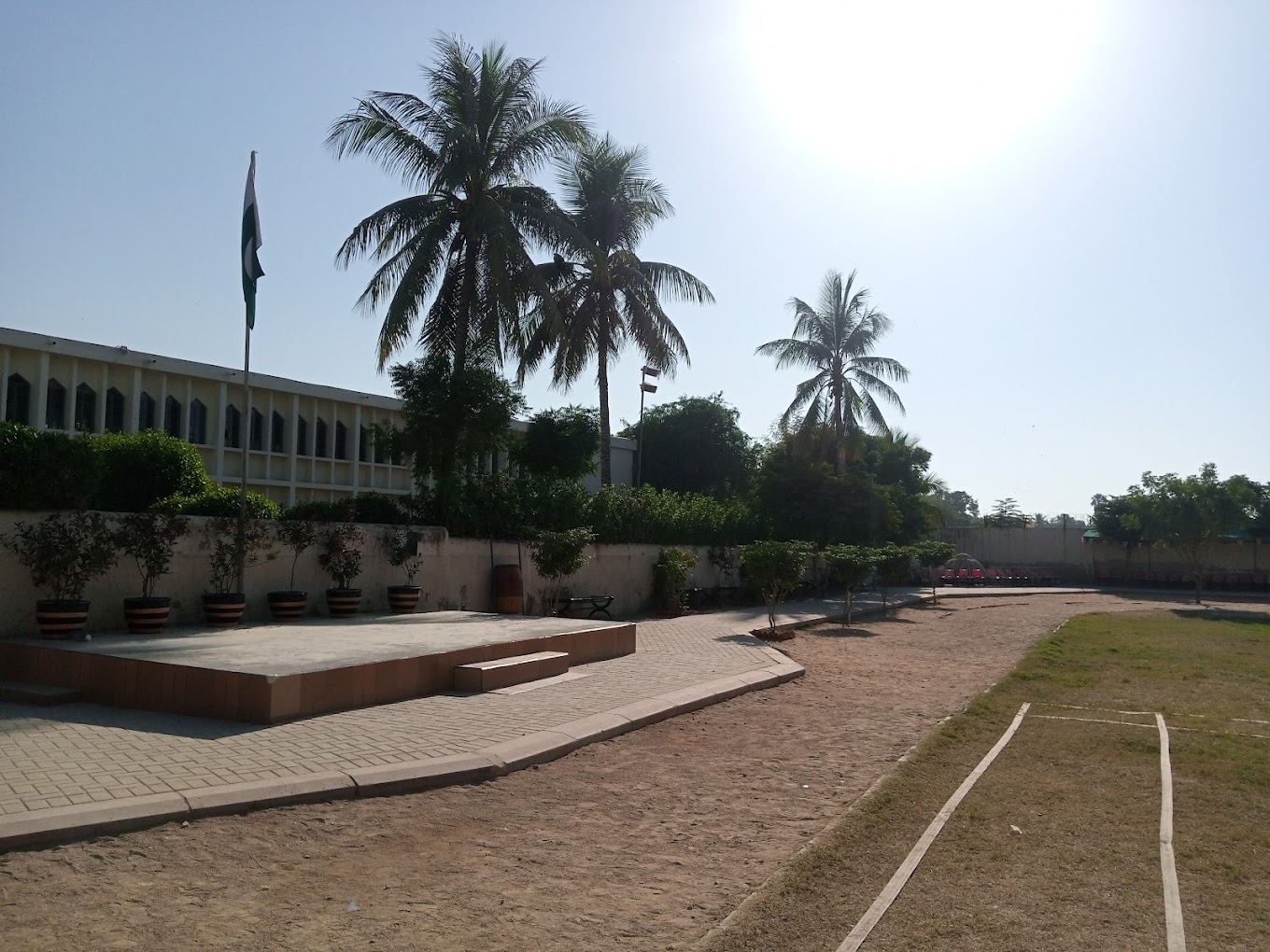 Palm trees and open grounds at an Aga Khan School campus in Karachi